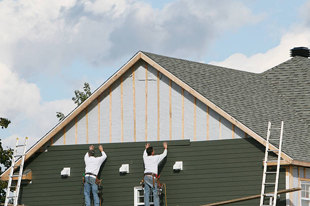 Professional Storm Damage Siding Repair technician working in Arlington, OH